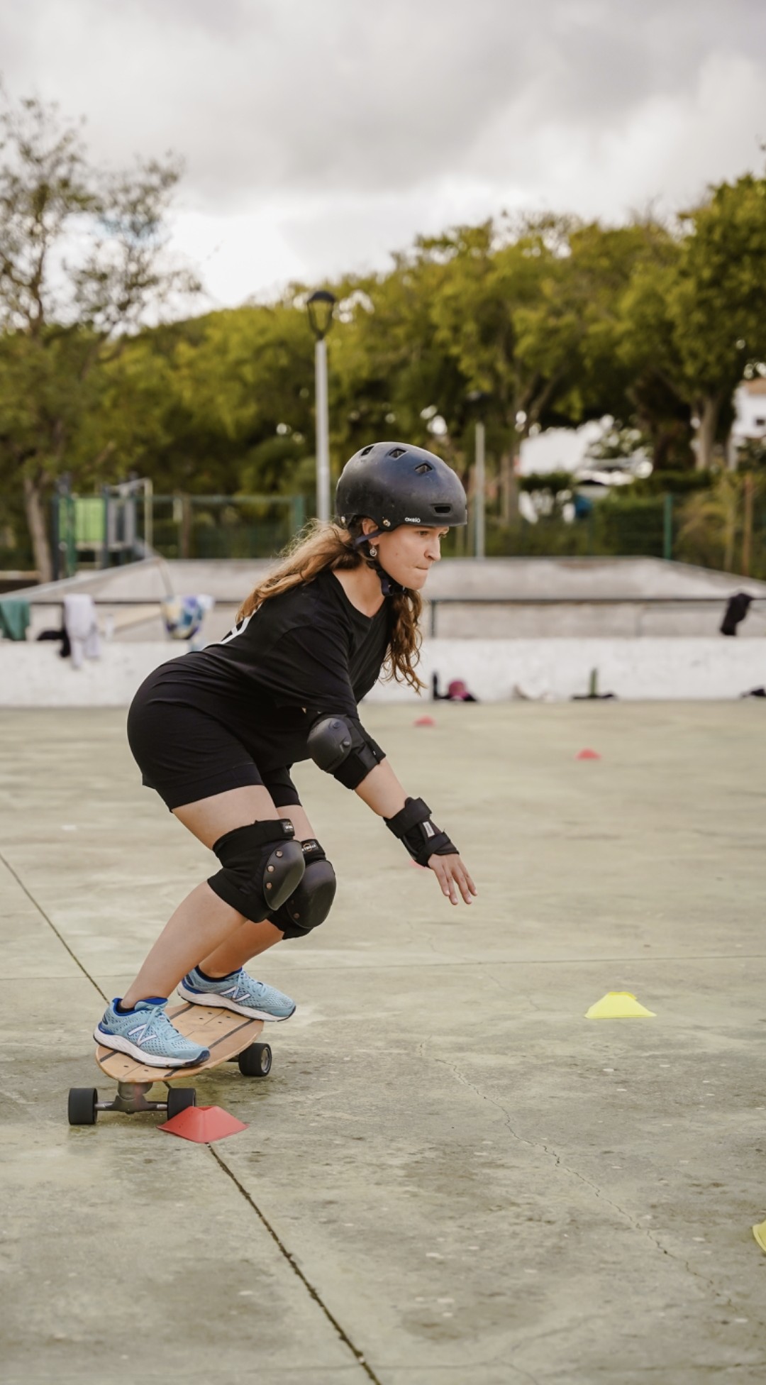 Dr Joanna Taylor skateboarding outdoors, representing movement and active lifestyle