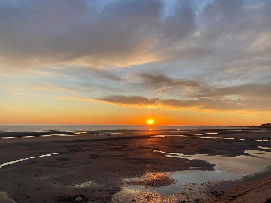 Sunset over Jersey coastline, representing calm, balance and a thoughtful approach to health and wellbeing