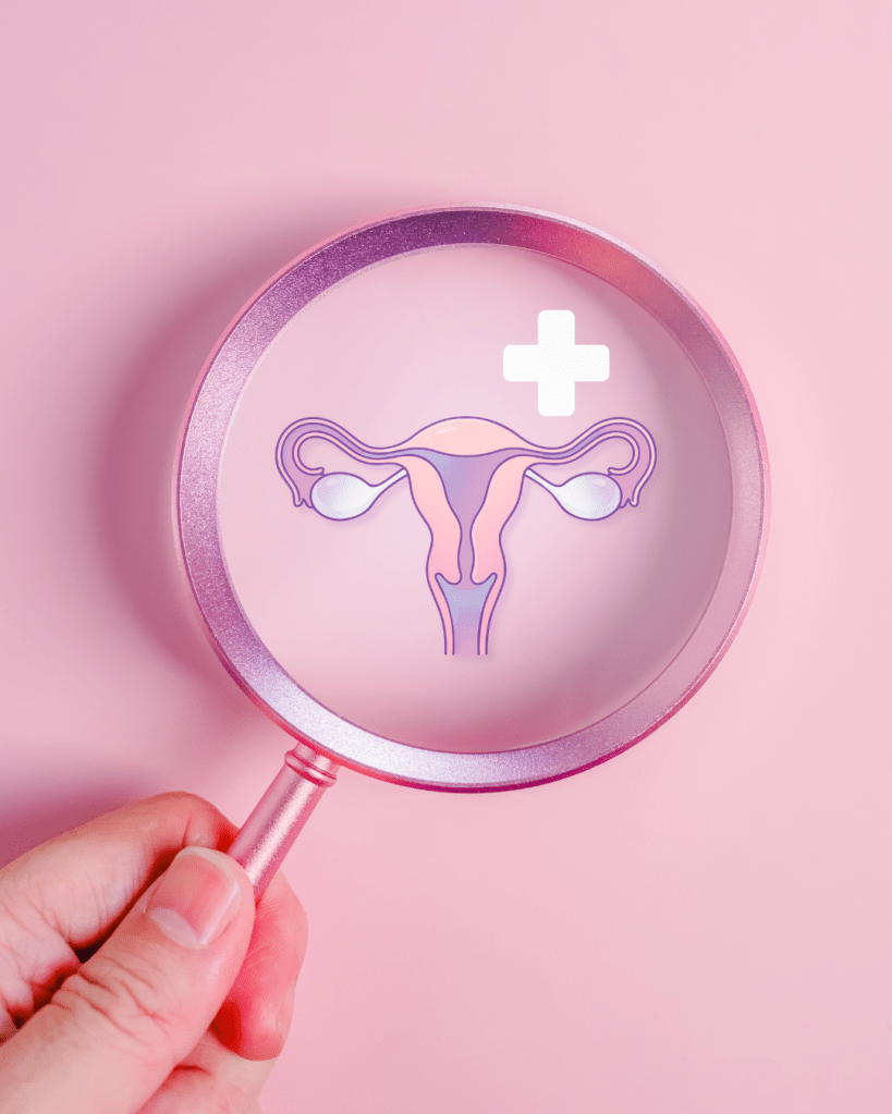 A hand holding a magnifying glass over a stylized illustration of the uterus and ovaries on a pink background, with a medical cross symbol.